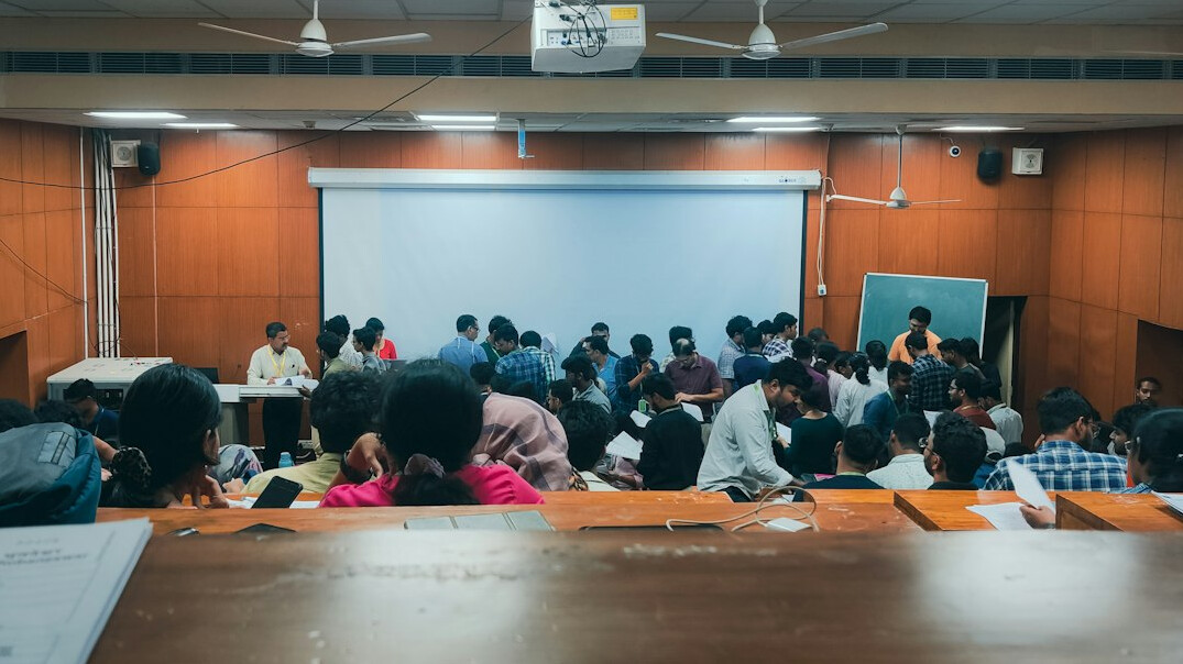 Training room with students at workstations learning video production