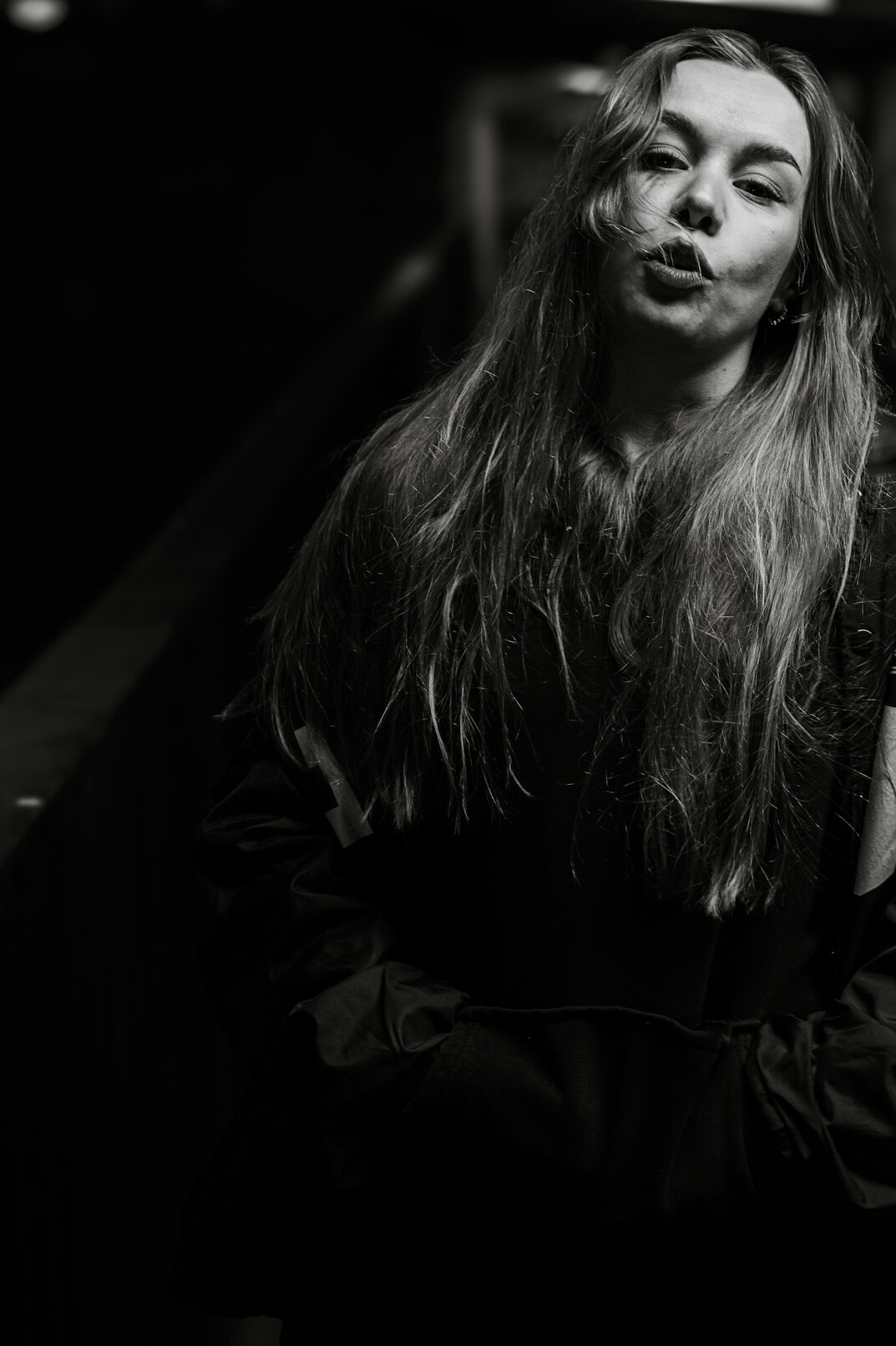 Portrait of a young woman with long hair smiling